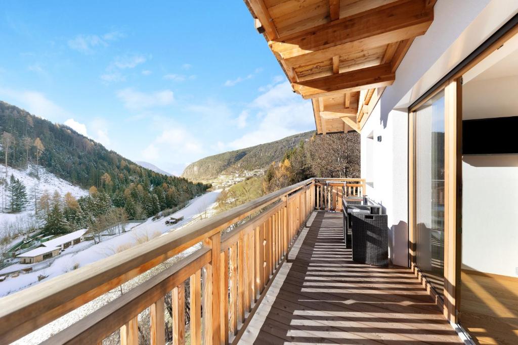 a balcony with a view of the mountains at Töniglerhof Apt Abendrot in Trodena