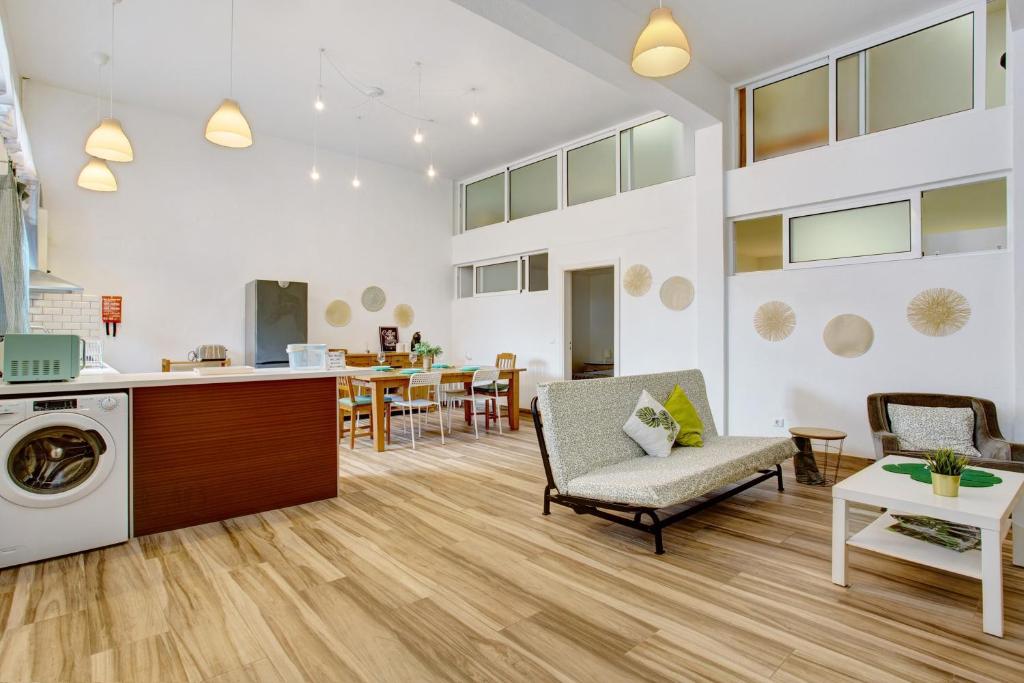 a living room with a kitchen and a dining room at Funchal Boa Nova Apartment in Funchal