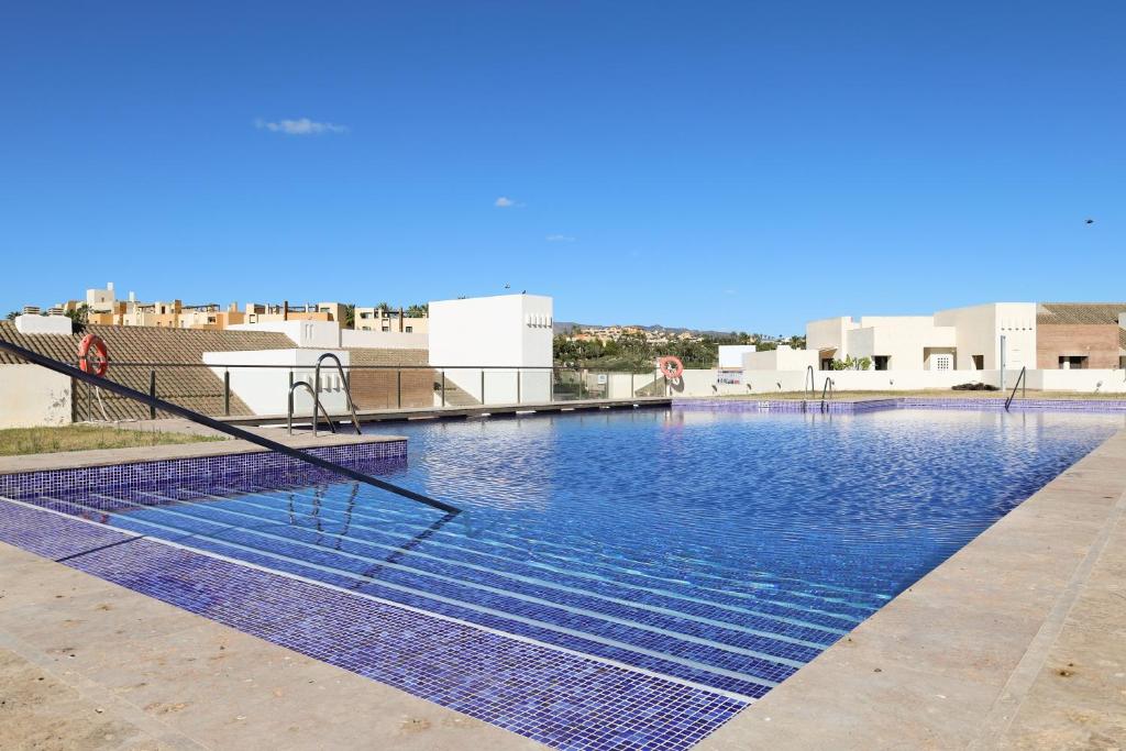 a swimming pool on the roof of a building at Golf Beach Vera in Vera