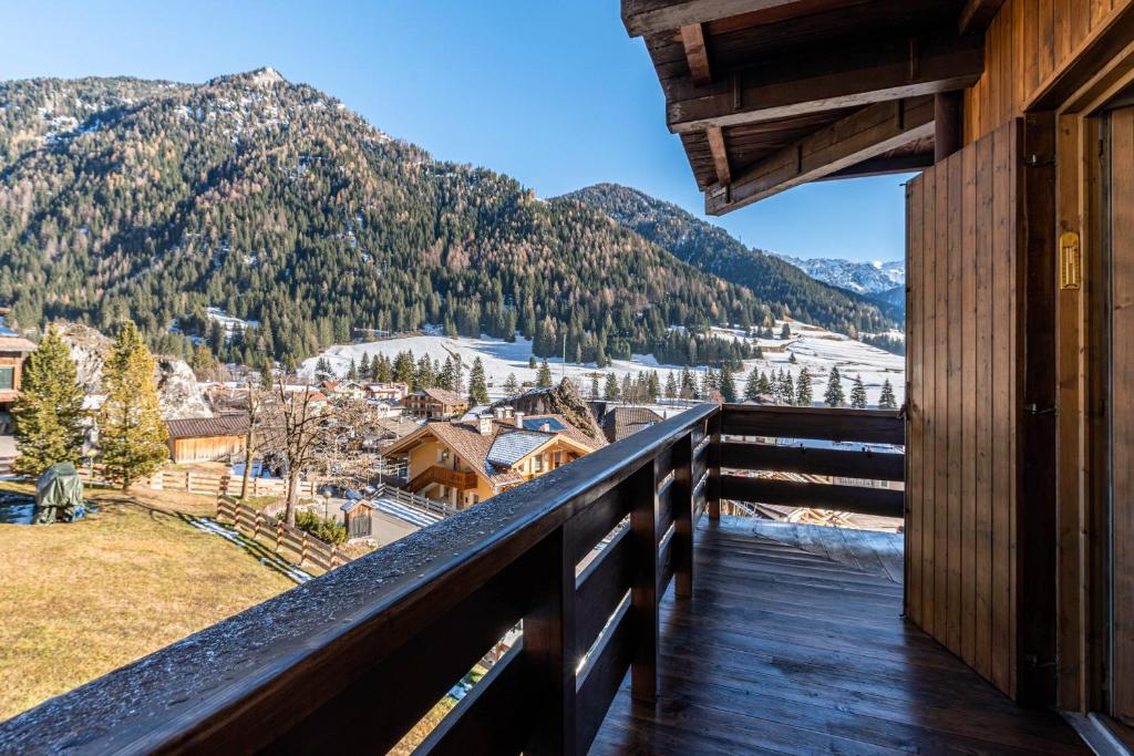 a balcony with a view of the mountains at Ciasa Apelli in Pozza di Fassa