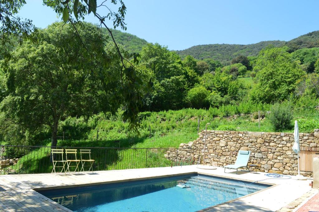 a swimming pool with a view of a mountain at La Rectoría de Castellar in La Vall de Bianya