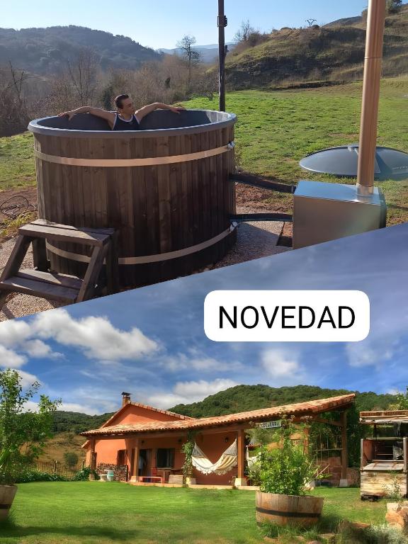 a man in a hot tub in a yard at Astial Ezquerra - Casa Rural in Ezquerra