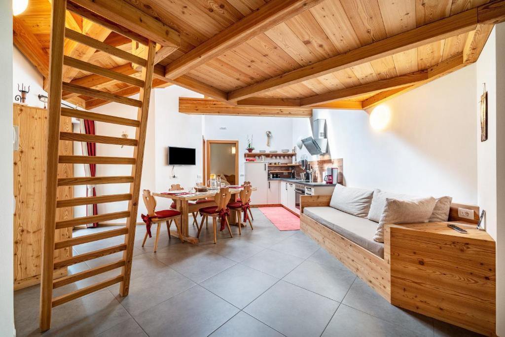 a living room with a couch and a table at Ferienhaus Larch Soge Apt Paula in Racines