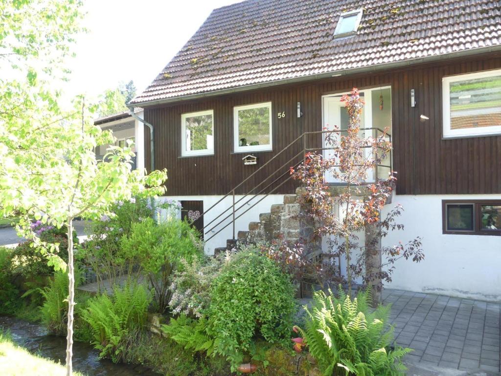 a house with a staircase in front of it at Ferienhaus Villa Wolffsschlucht in Oberzent