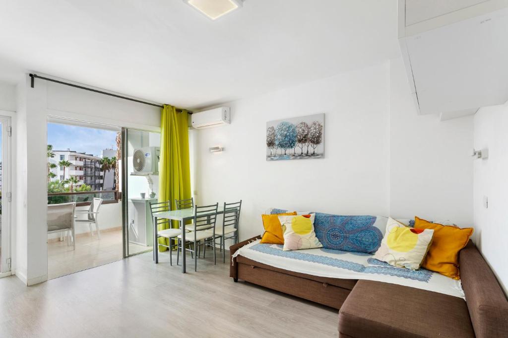 a living room with a couch and a table at Nice Apartment 1210 In Central Area in San Bartolomé