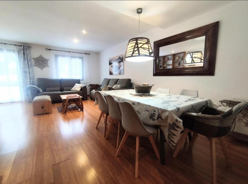 a living room with a table and a couch at Casa Arguis in Eriste