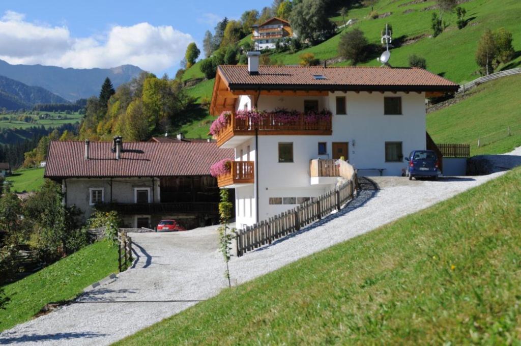a house on the side of a hill at Huberhof Mareit in Mareta