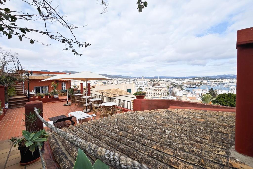 a balcony with a view of a city at Navila Estudio en la piscina in Ibiza Town