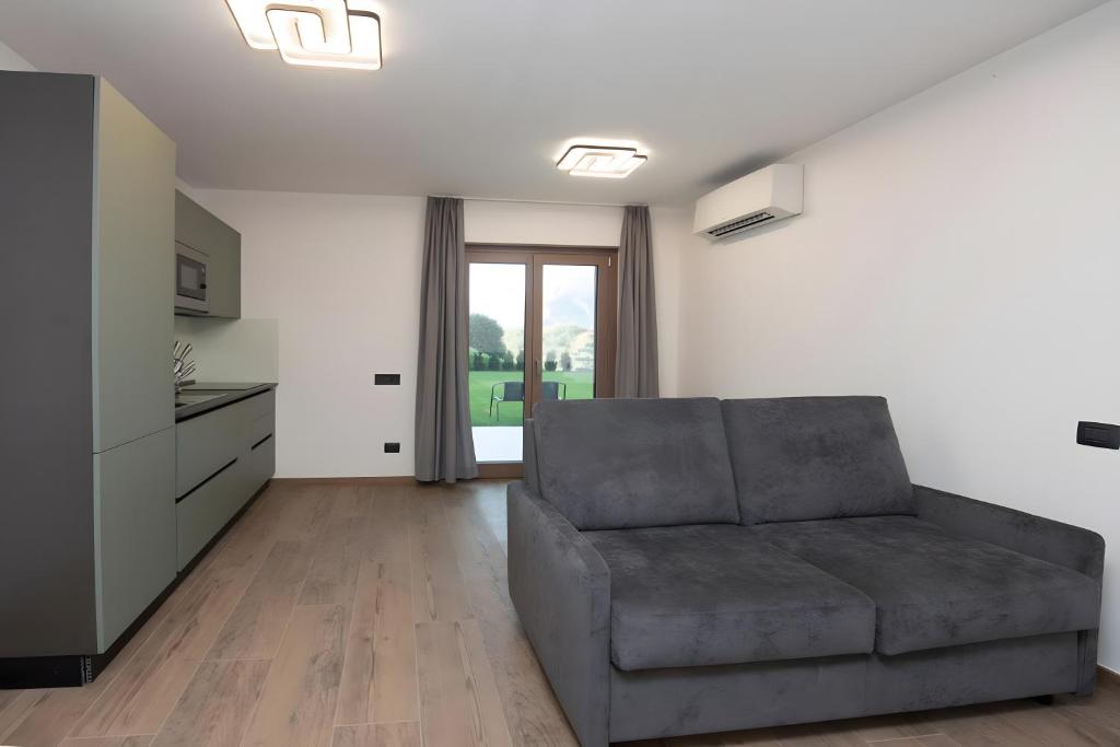 a living room with a couch and a kitchen at Appartamenti Suly 4 - Cir0085 in Saint Vincent