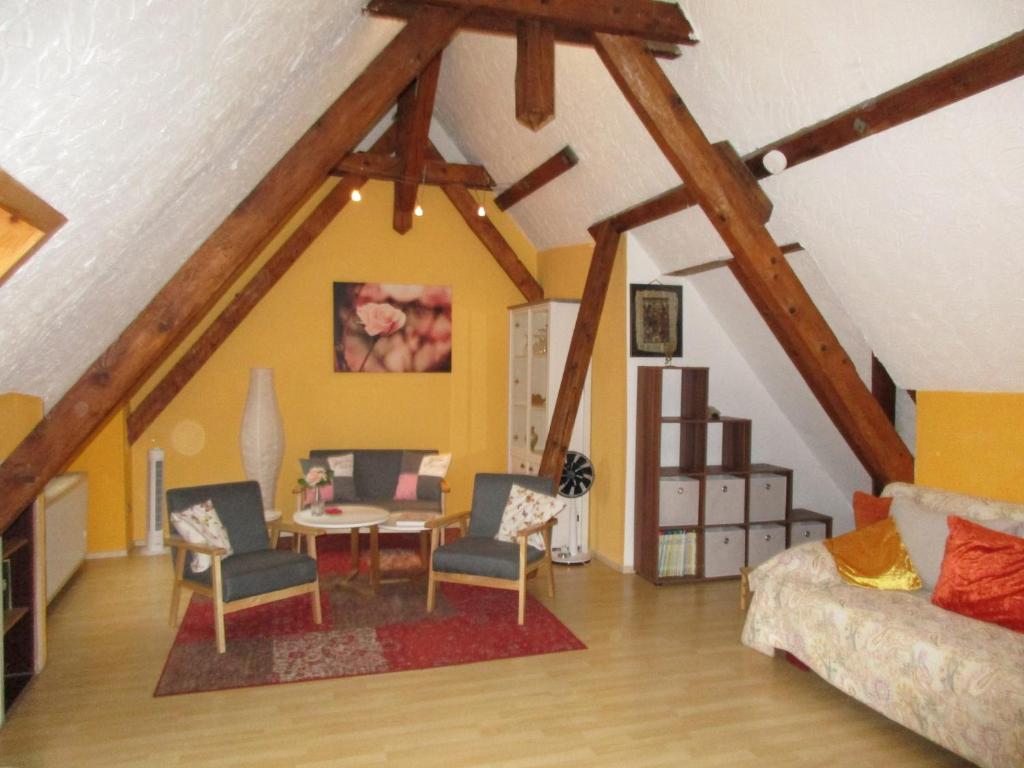 a living room with a couch and a table at La Rose in Tengen