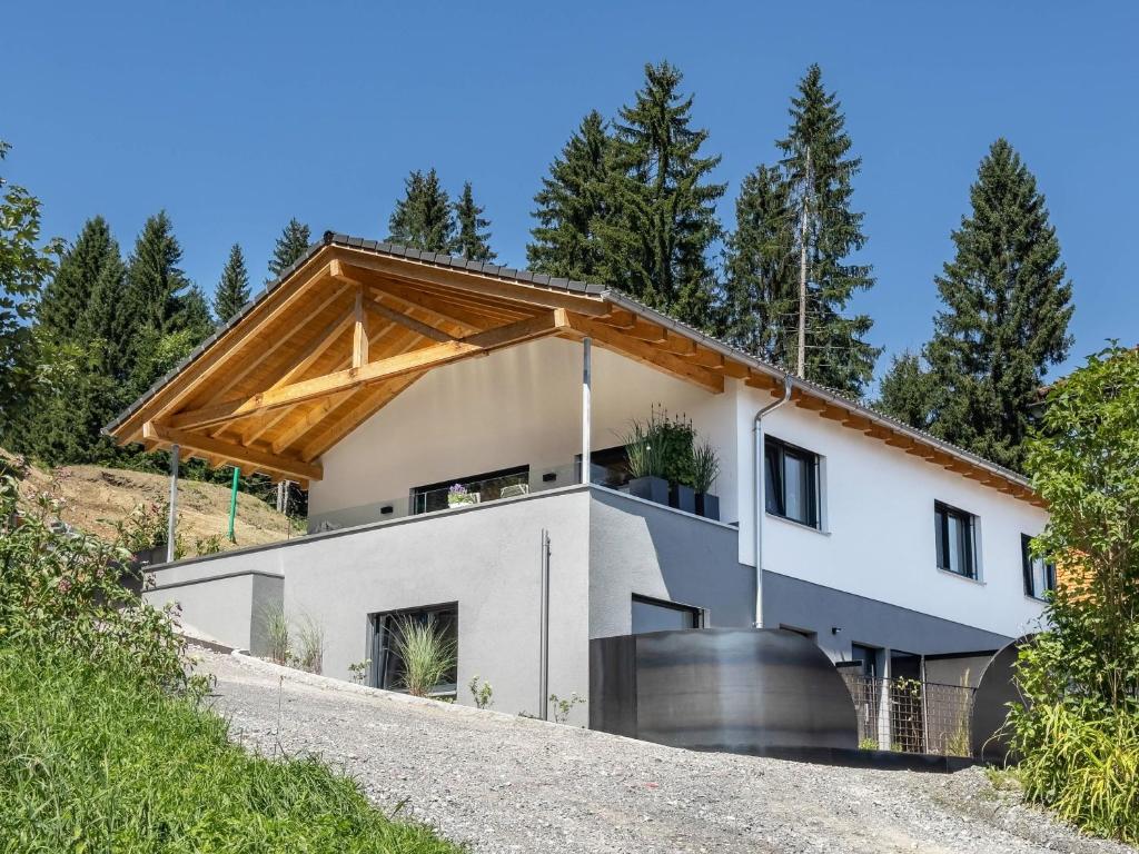 a house on the side of a hill at Ländle Lodge bei Bregenz in Langen bei Bregenz