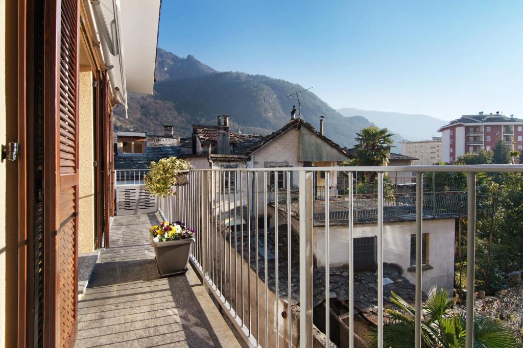 a balcony with a view of a mountain at Apartment Bossi View in Chiavenna