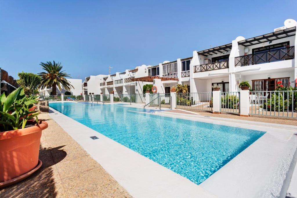 an image of a swimming pool in a building at Plus Romance in Puerto del Carmen