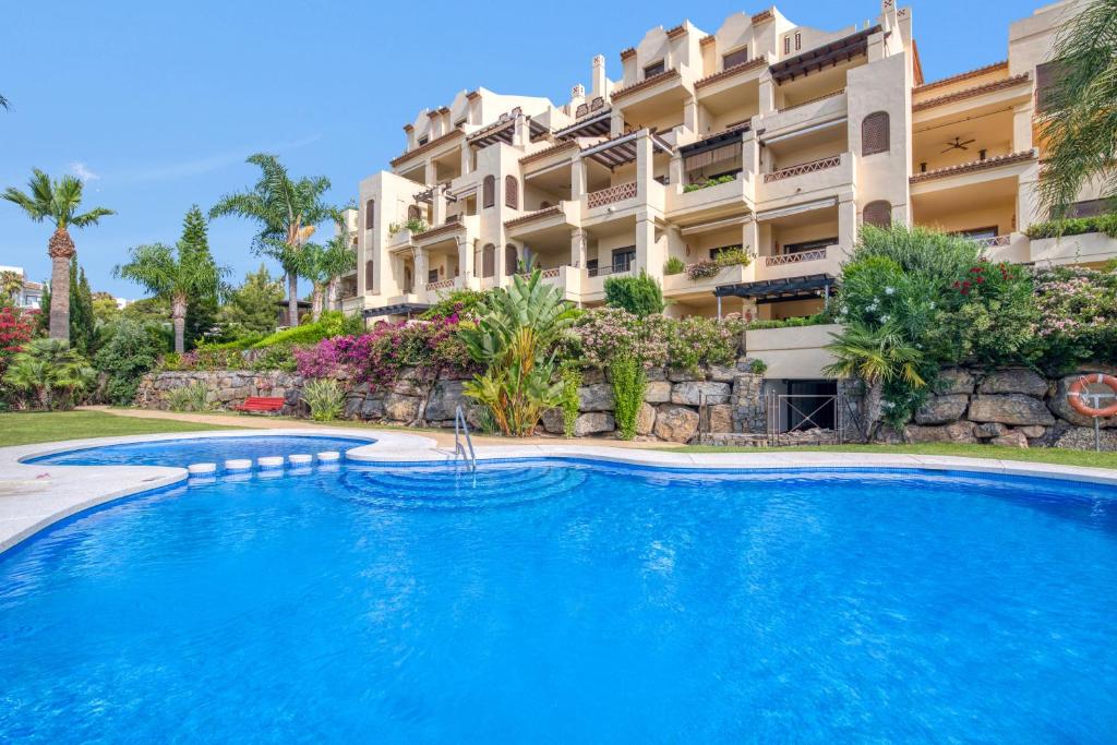 a swimming pool in front of a building at Villa Gadea 4-2 in Altea