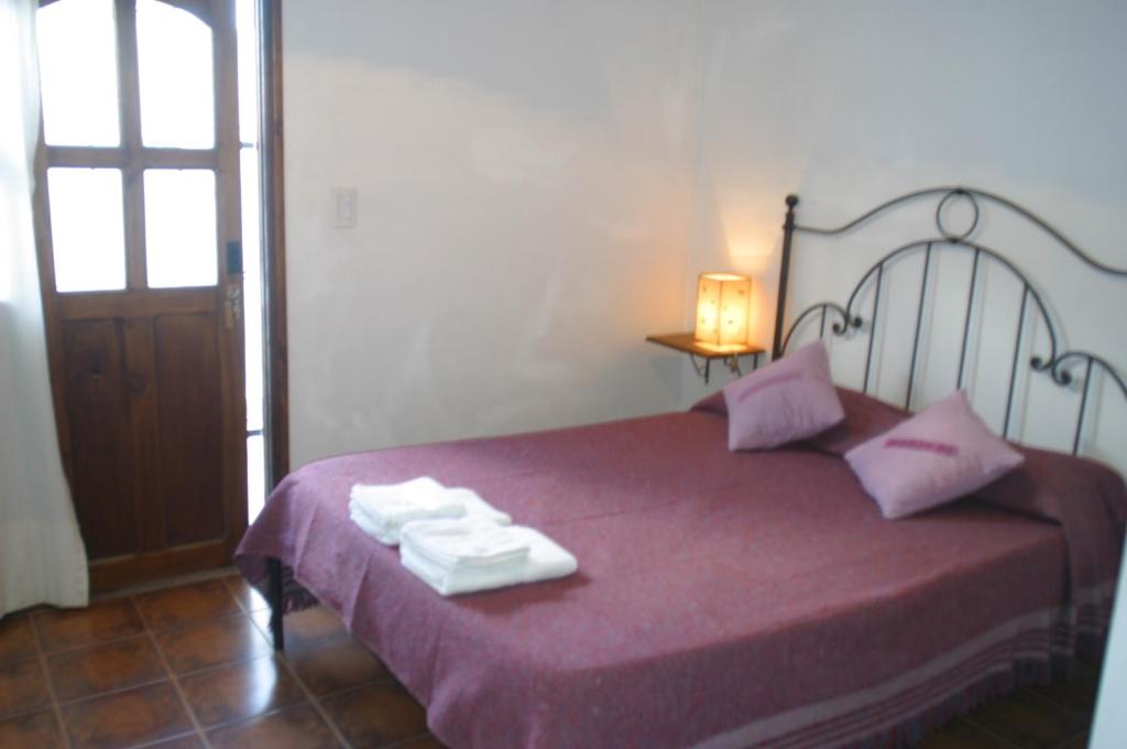 Cama ou camas em um quarto em Hostal Las Tinajas de Cachi