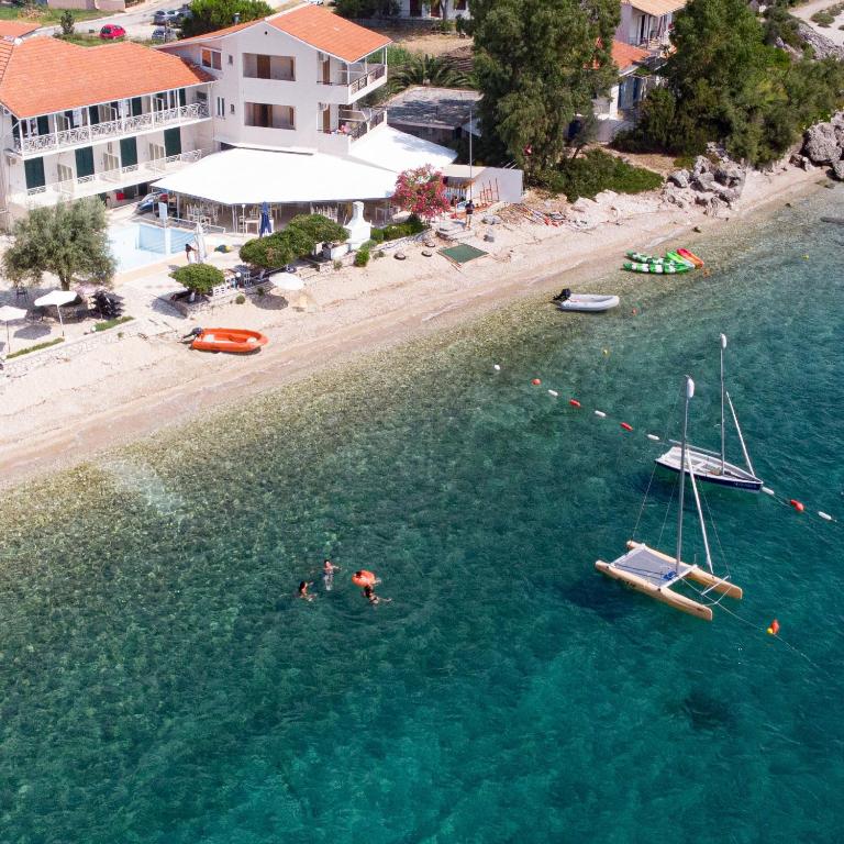 an aerial view of a beach and a boat in the water at Nikiana Sailing Beach Club in Nikiana
