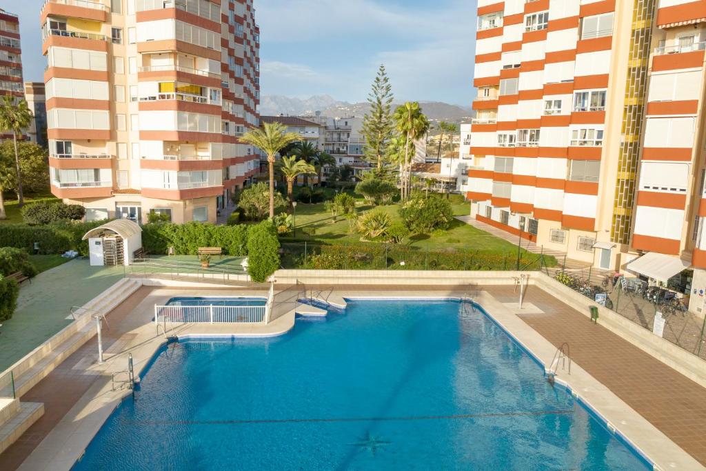an overhead view of a swimming pool in a building at Estudio Bloque 80 in Torrox