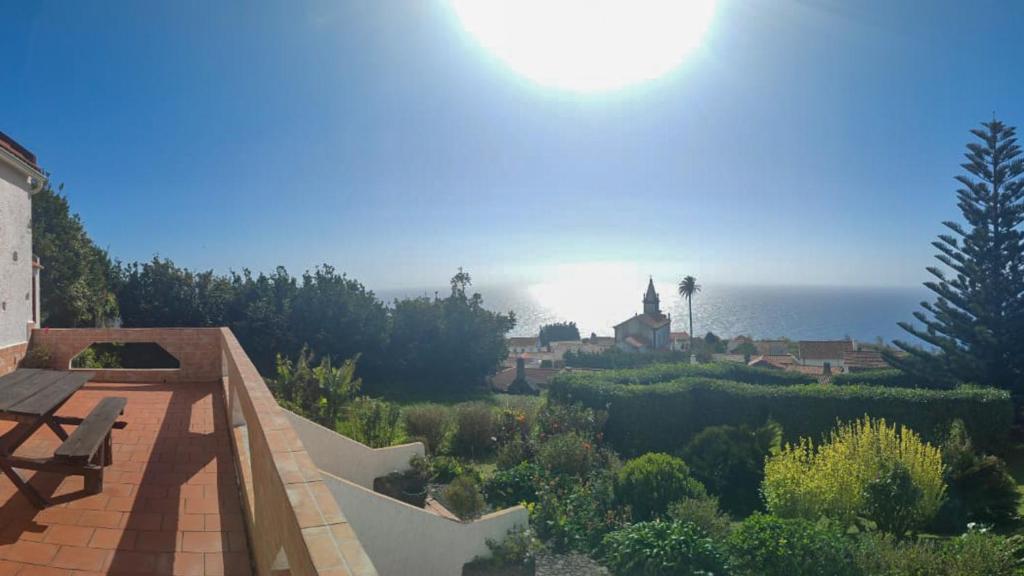 a view of a house with a view of the ocean at Villa Lomba Bela Vista in Lomba