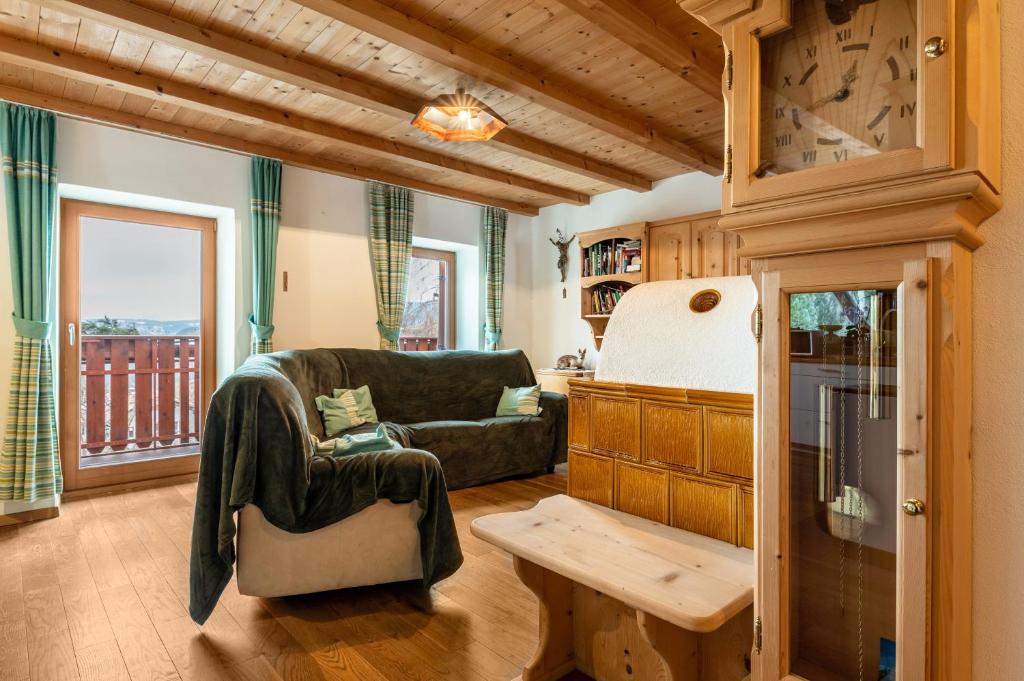 a living room with a couch and a table at Ferienwohnung Toni II in Siusi