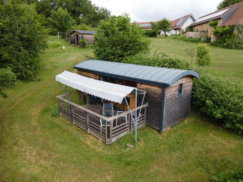 an overhead view of a building with a roof at Tiny House, Clim et Bassin in Auriac-du-Périgord
