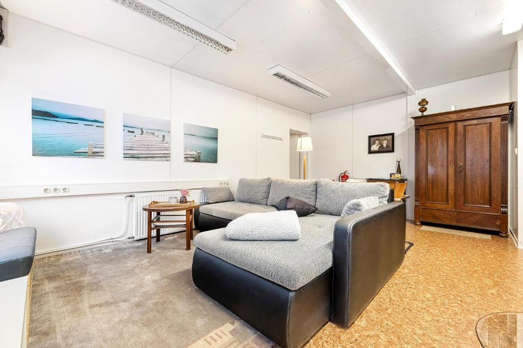 a living room with a couch and a table at Wohncontainer Derdak in Boizenburg