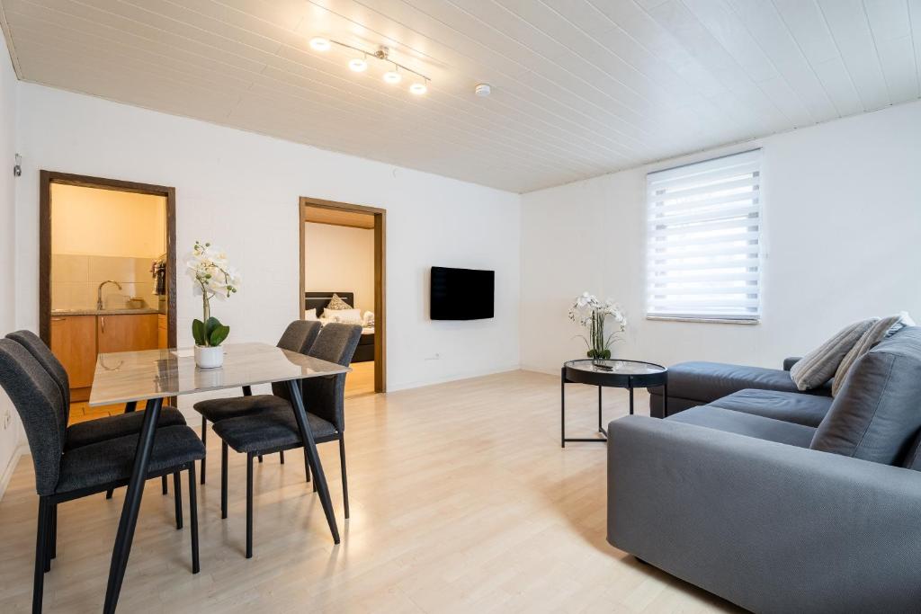 a living room with a couch and a table at Evin's Apartment in Kehl am Rhein