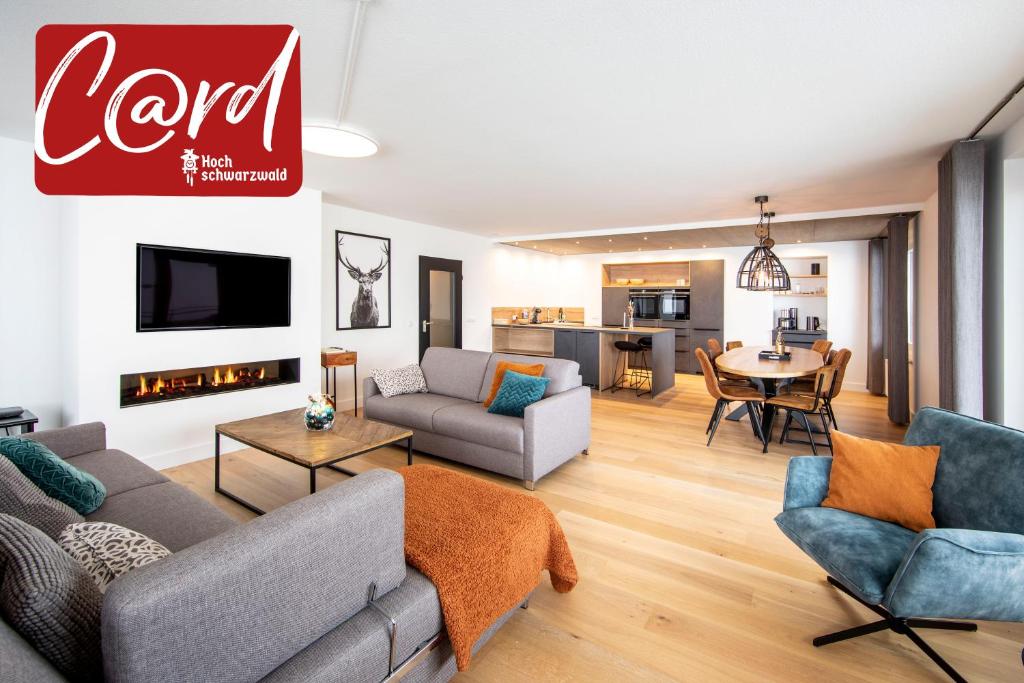 a living room with a couch and a table at Ferienwohnung Penthouse Feldberg in Feldberg