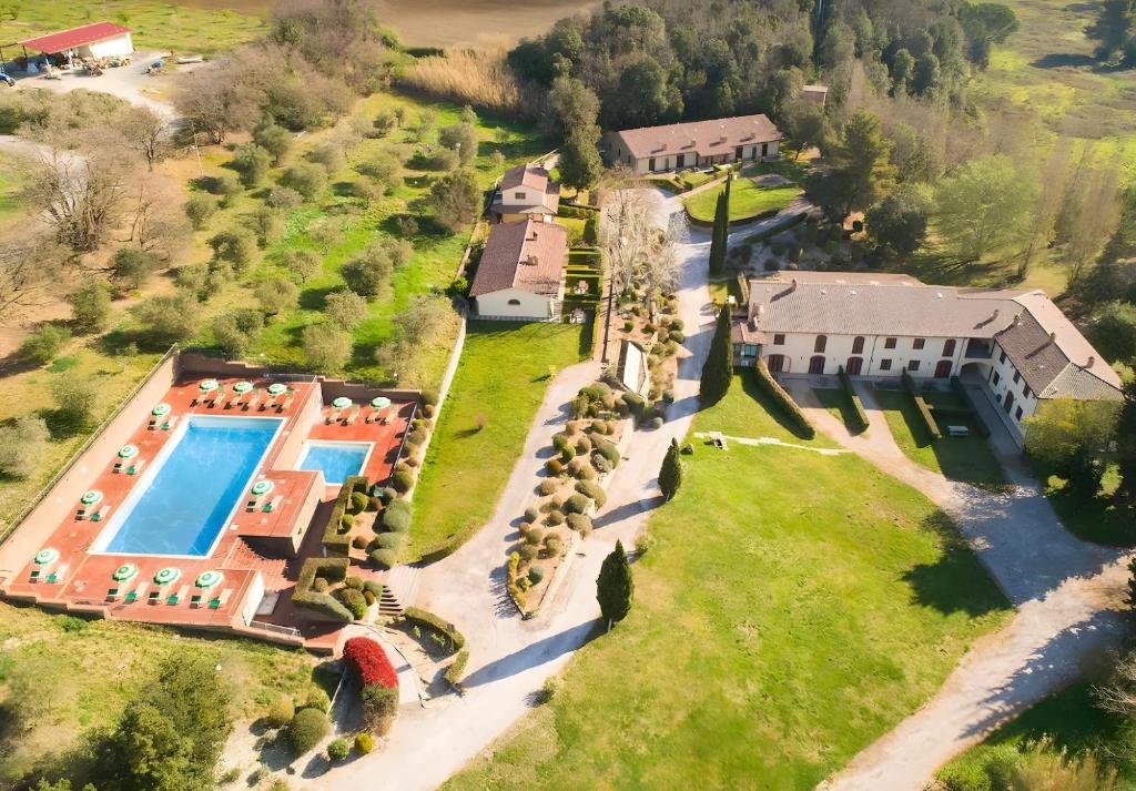 an aerial view of a mansion with a swimming pool at Borgo San Carlo in Santa Luce