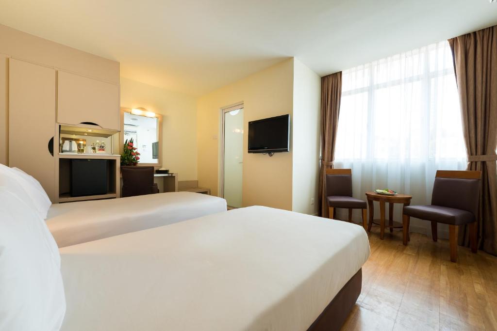 Postel nebo postele na pokoji v ubytování Hotel Sentral Georgetown @ City Centre