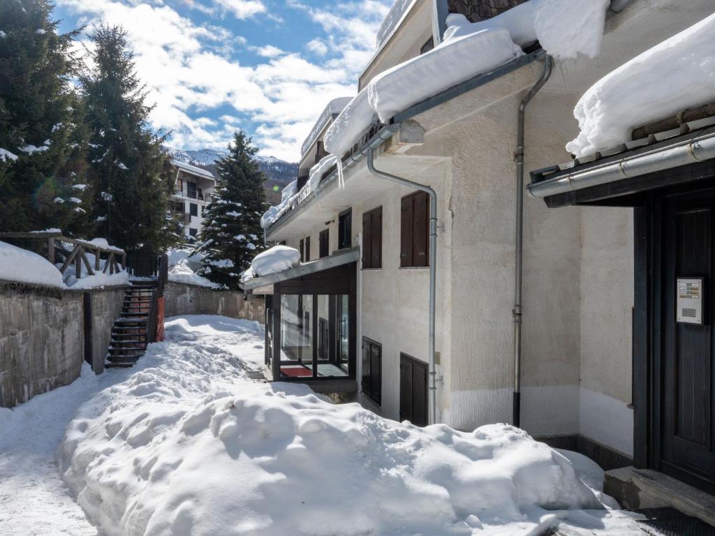 a pile of snow in front of a building at Apartment Richardette by Interhome in Sauze d'Oulx