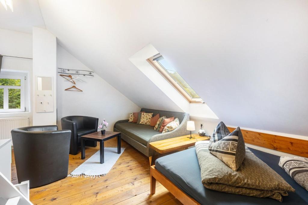 a living room with a couch and a table at Ferienhaus Enztal in Zweifelscheid