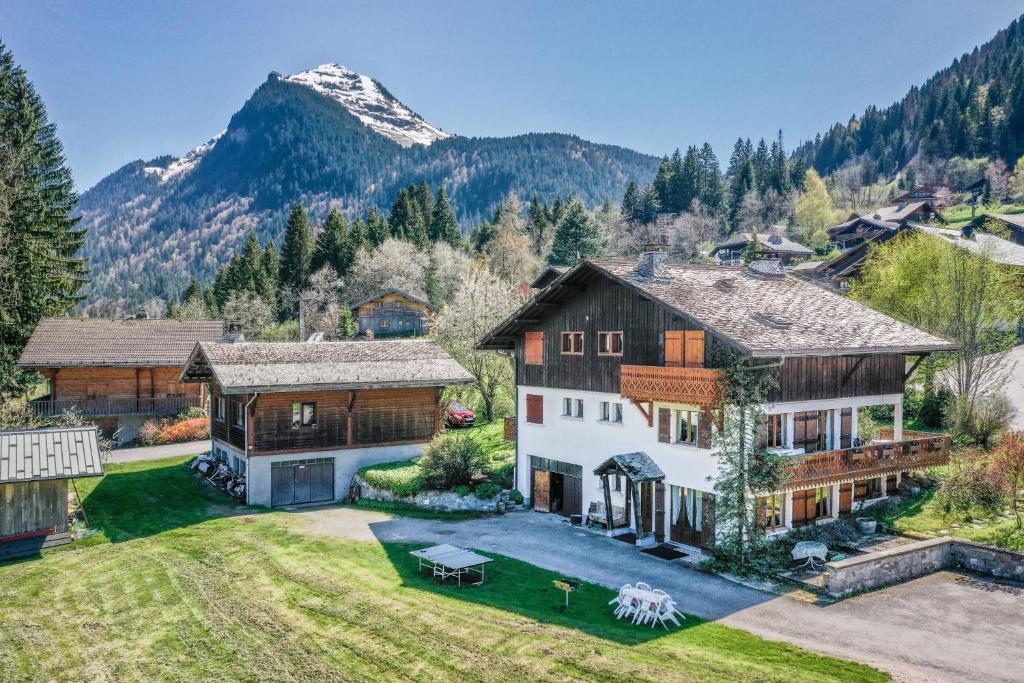 an aerial view of a house with a mountain at Studio Chénives - Morzine in Morzine