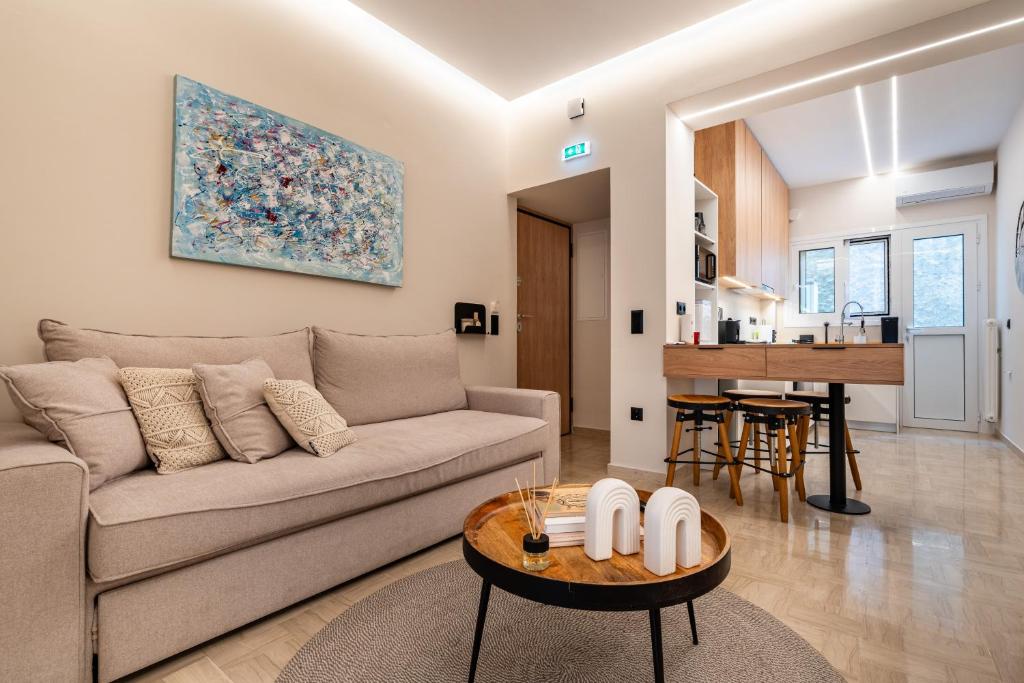 a living room with a couch and a table at The Apex Boutique Apartment B2 in Athens