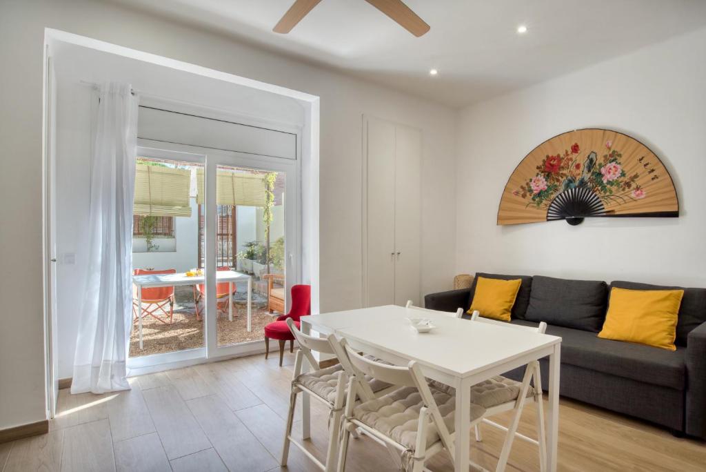 a living room with a couch and a table at Old Side Platja d Aro in Platja d'Aro