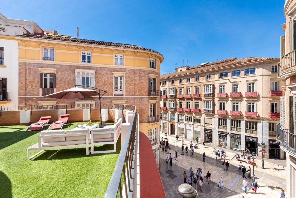 a view from a balcony of a city with buildings at Terraza Larios in Málaga