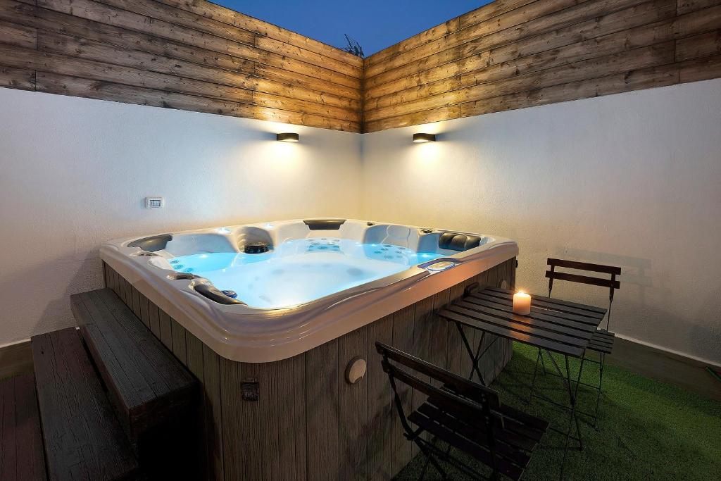 a large tub in a room with a table and chairs at Casa Miranda 1 in Candelaria