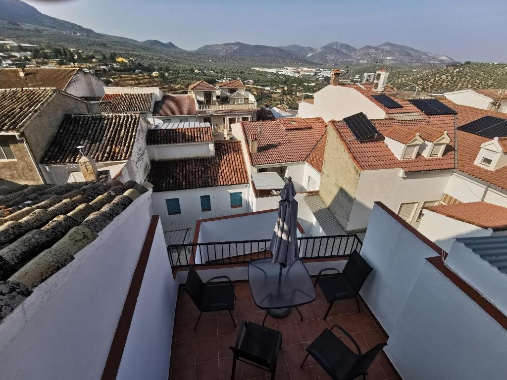 a view from the balcony of a house with a table and chairs at Casa ricapaz - Long Term Advantage in Castillo de Locubín
