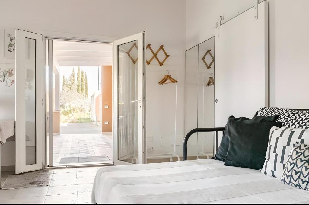 a room with a bed and a glass door at Ruralholidays in Calimera