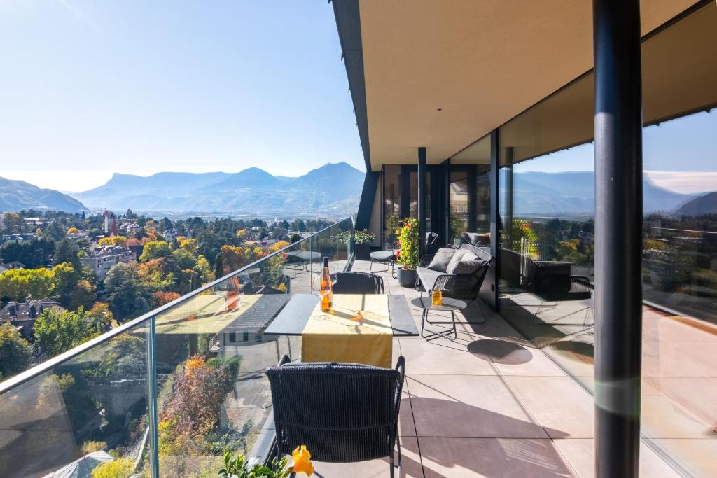 a balcony of a house with mountains in the background at Levita Living Freiheit in Tirolo