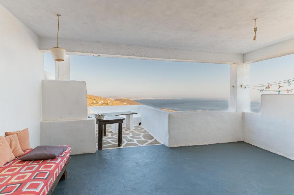 a living room with a view of the ocean at Haus Nikos - Tinos - Arnados in Arnados