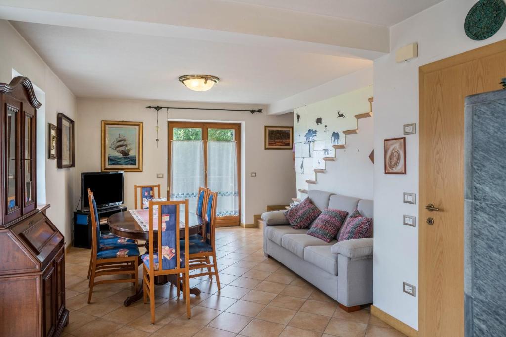 a living room with a couch and a table at Villa Fiore in Lamon