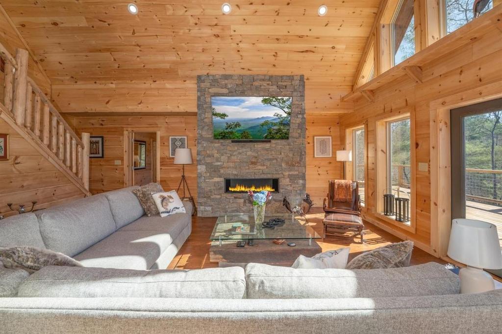 a living room with a couch and a fireplace at El Escorpio North · El Escorpio North - New Rental in Brevard