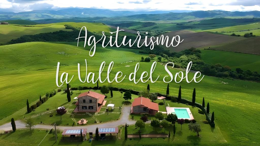 a villa in a green field with the words agriculture a village oddote at La Valle Del Sole - Val D'Orcia in Castiglione dʼOrcia