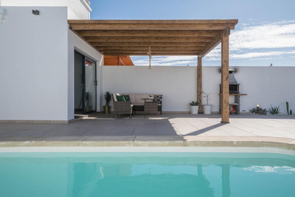a view of a house with a swimming pool at Villa Esmeralda in Lanzarote