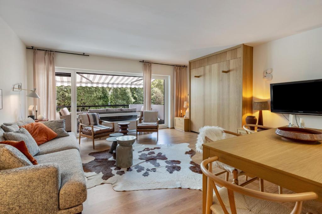 a living room with a couch and a table at Ferienwohnung Schluchsee Idylle in Schluchsee