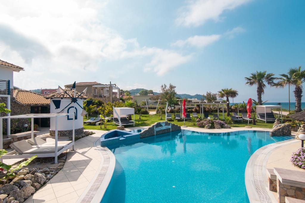 a pool at a resort with a slide at Mirage Arillas Studio Type B15 in Arillas