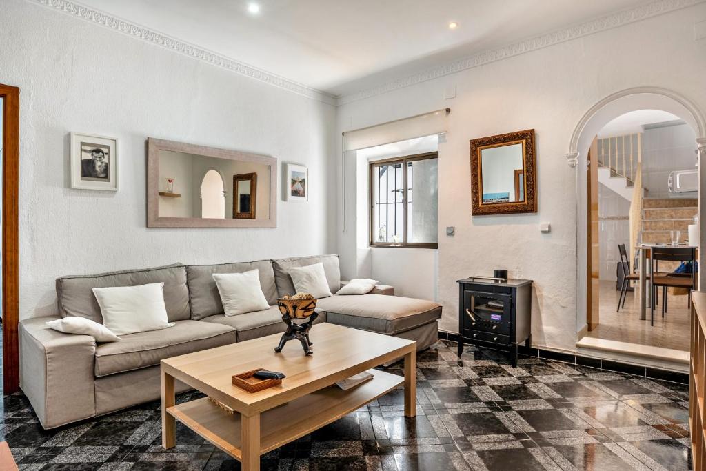 a living room with a couch and a table at Casa Calle Ancha in Barbate