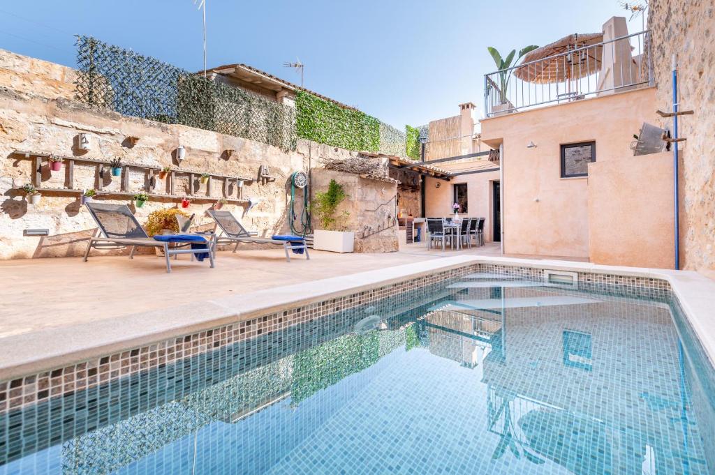 a pool in the backyard of a house at Cas Solleric in Petra
