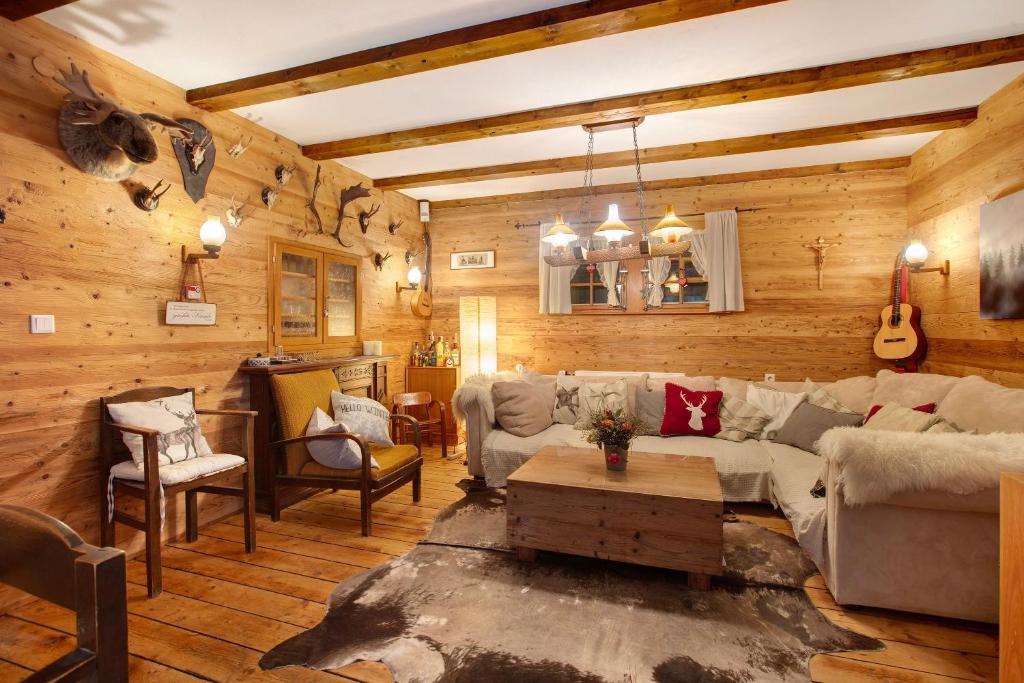 a living room with a couch and a table at Zähringer Hütte in Feldberg