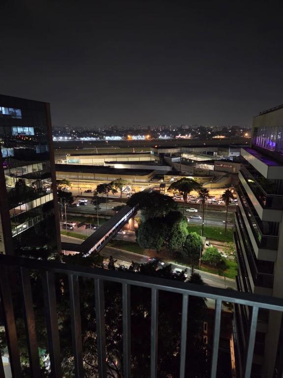 a roller coaster in a parking lot at night at Studio aeroporto Congonhas in São Paulo